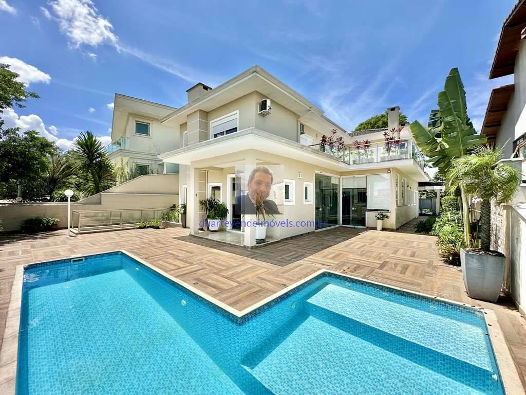 Casa de Condomínio à venda e aluguel com 4 quartos, 358m² - Foto 1